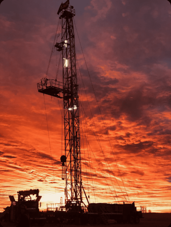 GeneralWellService_Rig Oil rig working at sunset